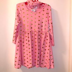 Pink dress with gold hearts.